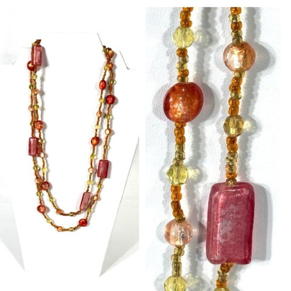44" continuous salmon colored beaded necklace.